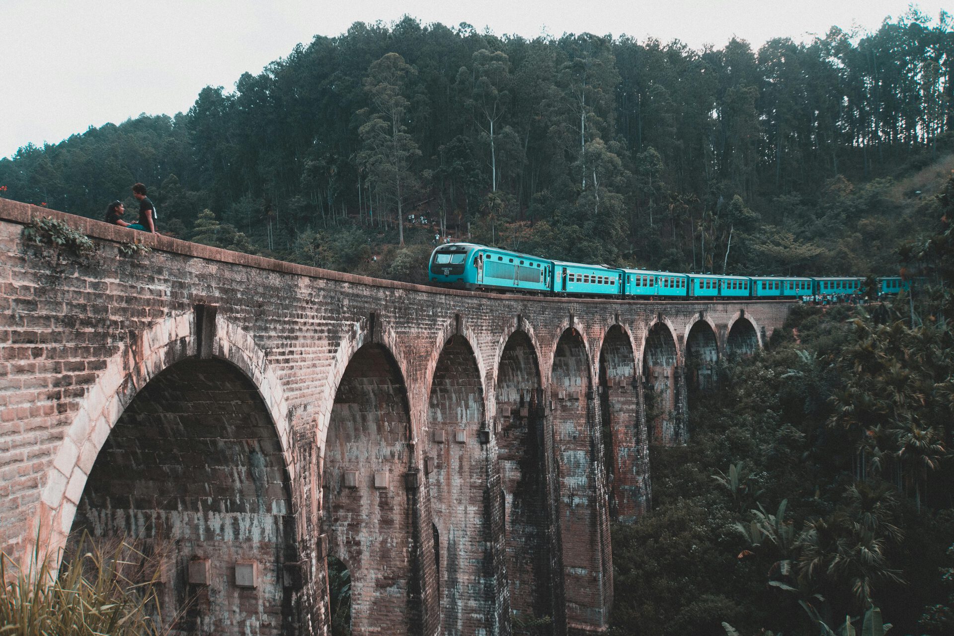 Ella's Nine Arches Bridge framed by lush tea estate hills