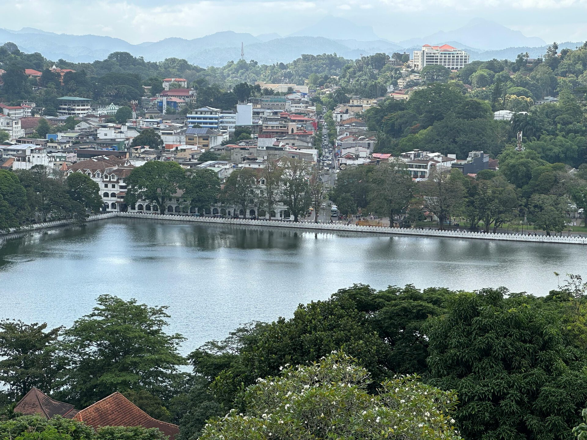 Kandy Lake at dusk with the Temple of the Tooth illuminated in the background